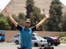 Thomas Andersen, OZ1AA, poses in Egypt with a pyramid in the background.